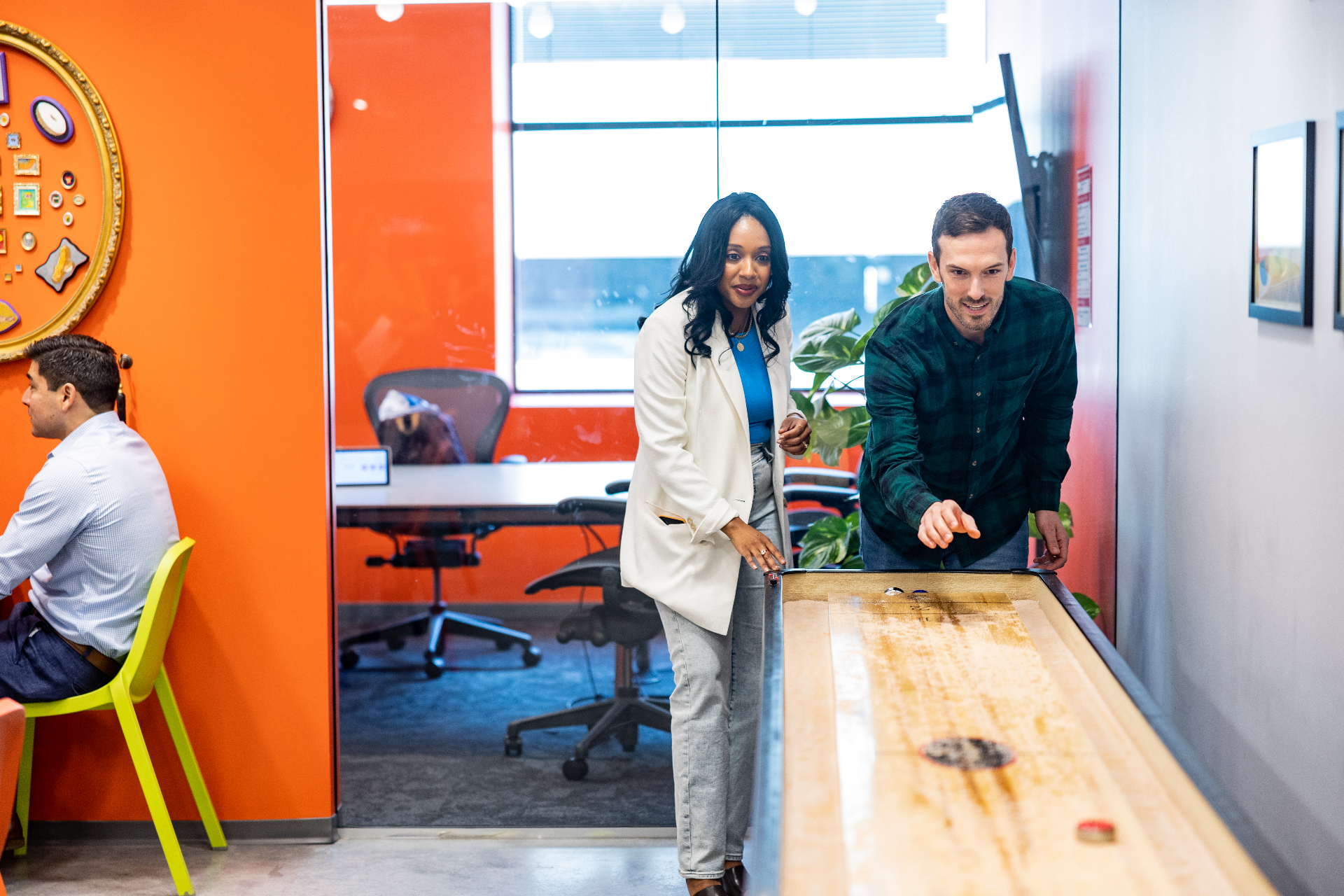 CIC members playing shuffleboard in the game room